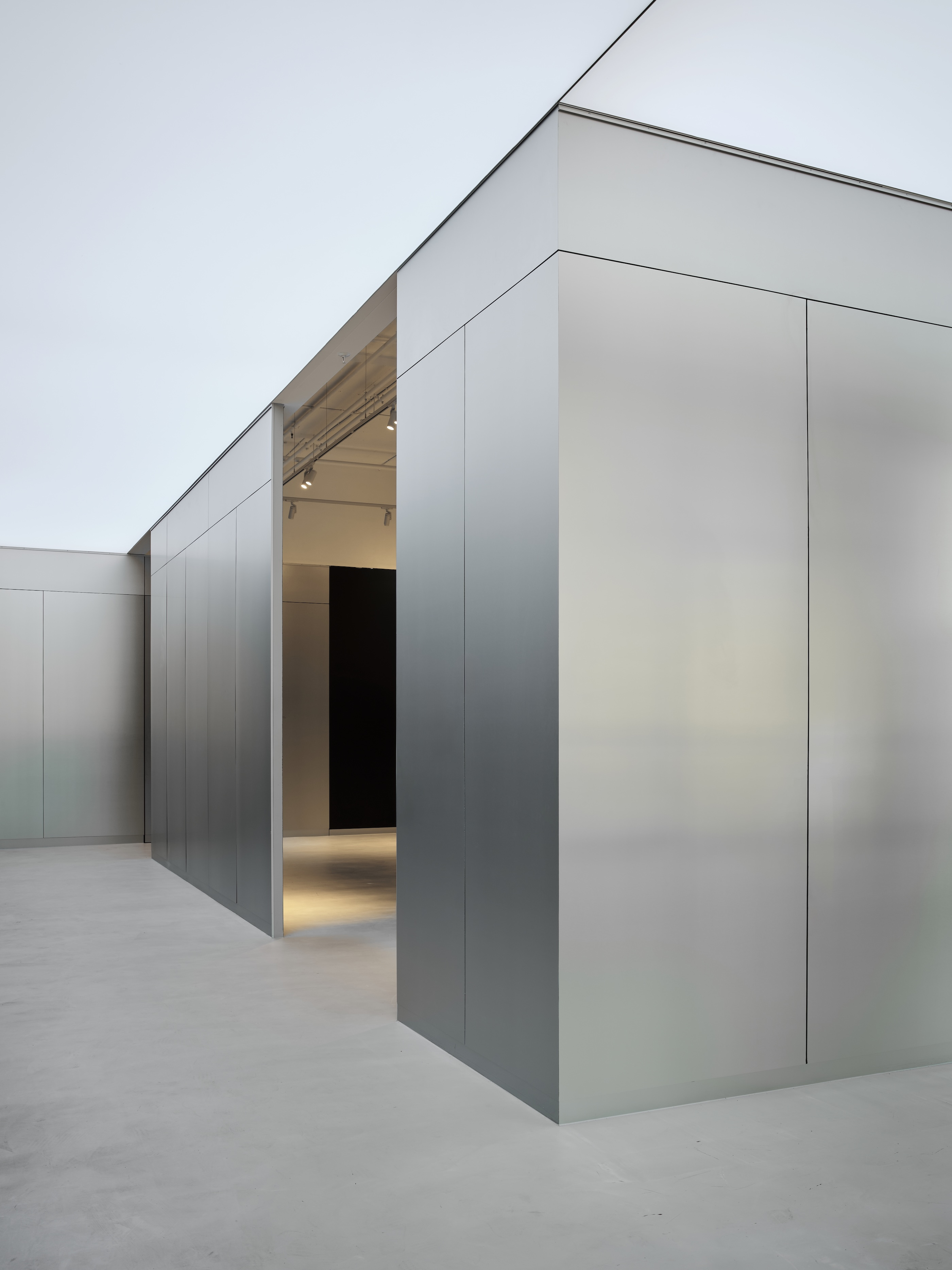 Interior with curved metallic wall